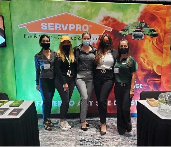 Females Employees with Servpro brand background.